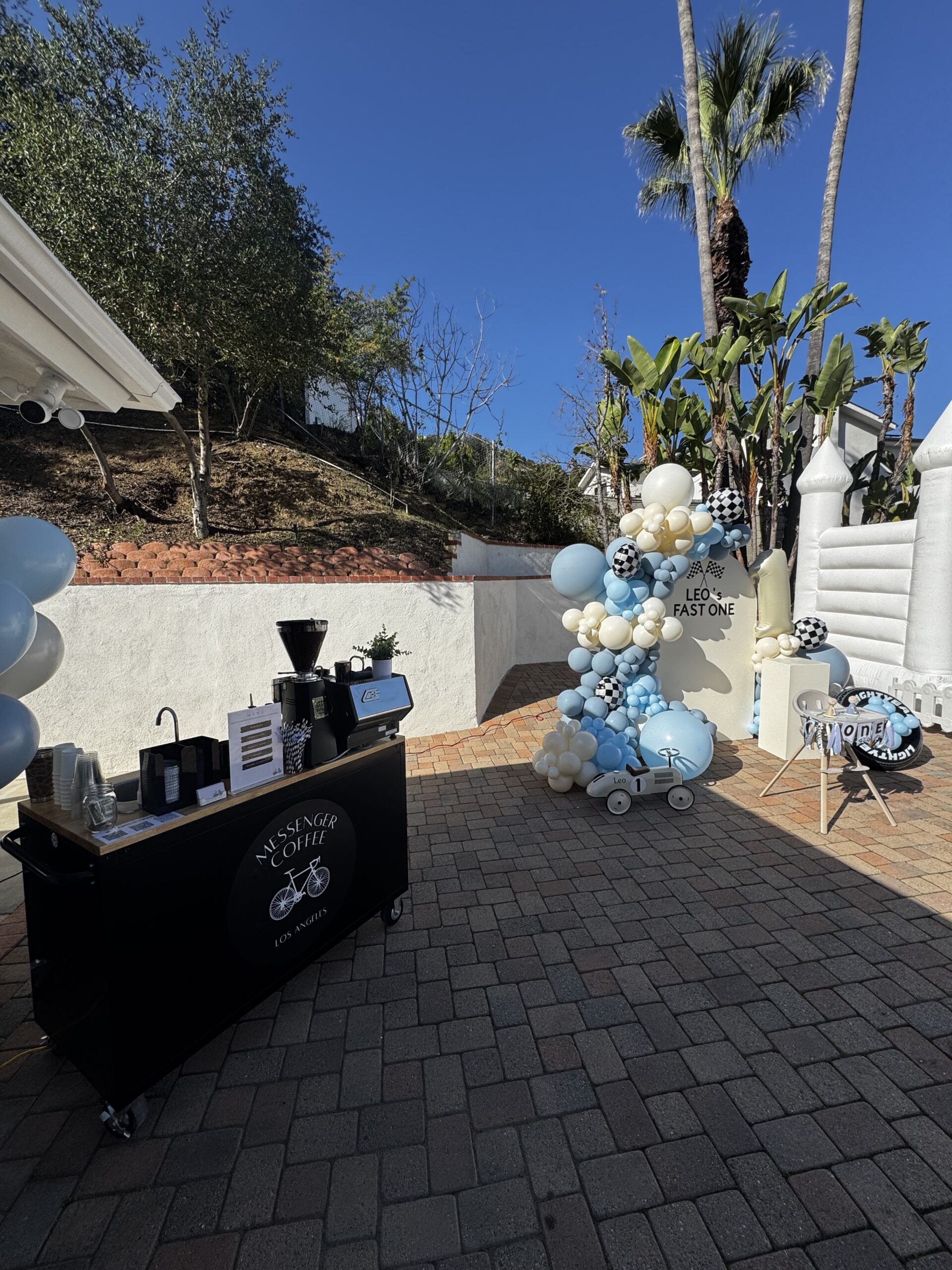 Mobile coffee cart service in Los Angeles catering an outdoor birthday party with espresso drinks and custom latte art