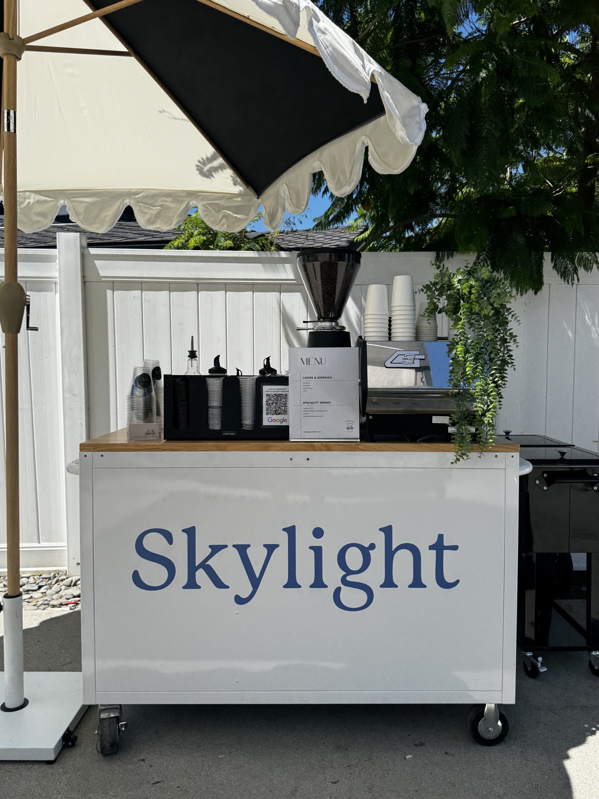 Coffee cart in Los Angeles with custom branding serving hot and iced drinks on a set of a production