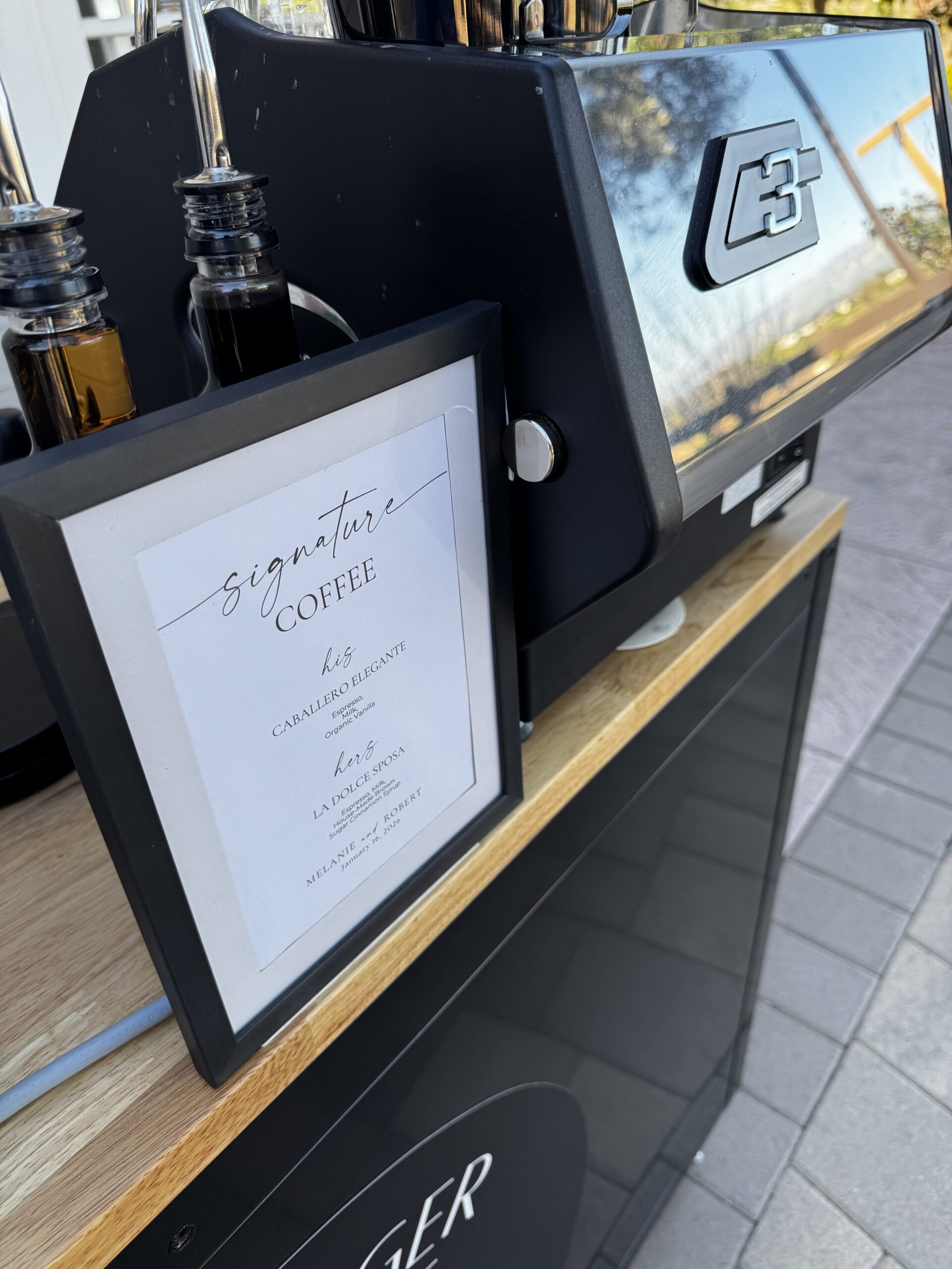 A coffee menu for a wedding on top of a coffee cart in Ventura County