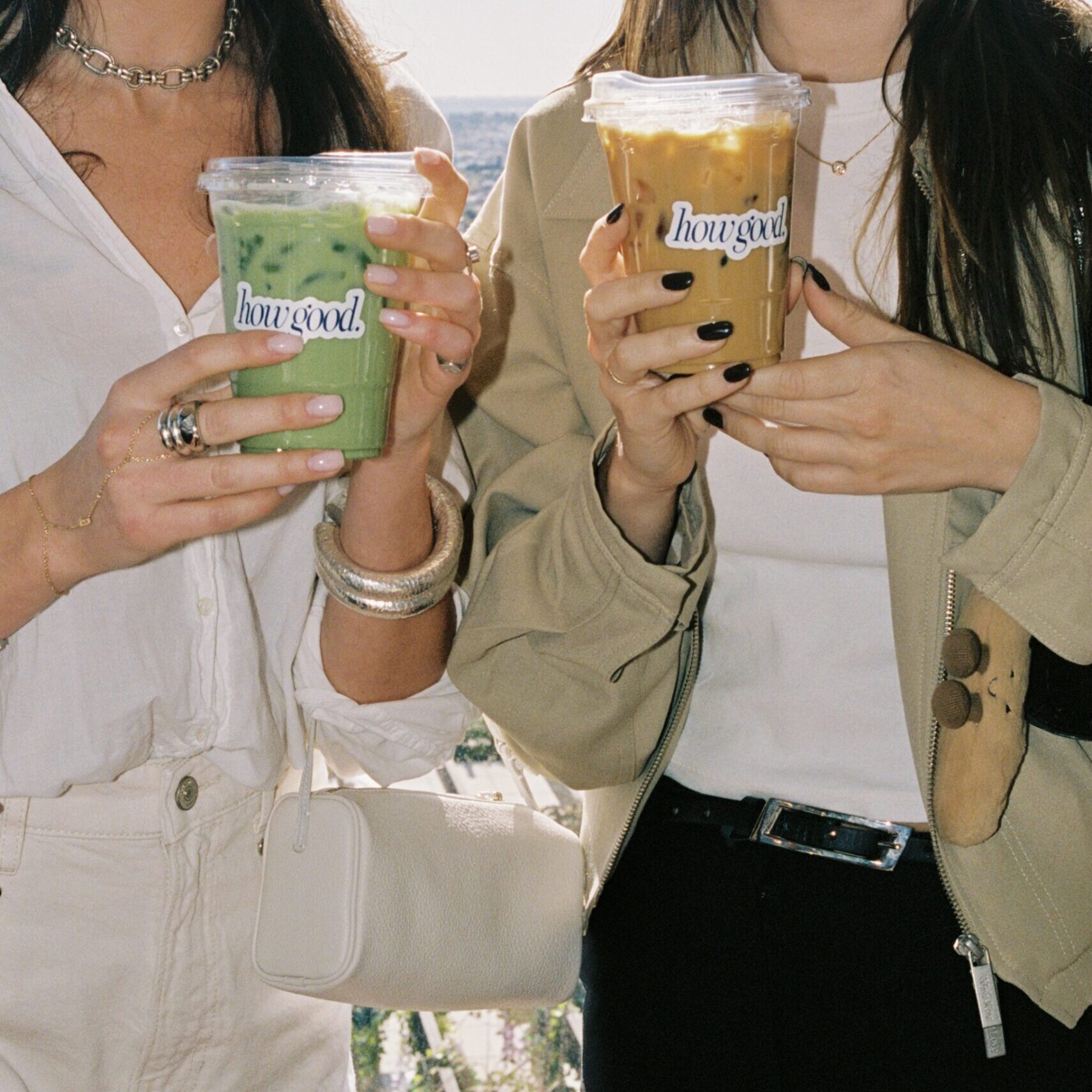 Friends drinking a latte and matcha made by coffee cart Messenger Coffee in Los Angeles