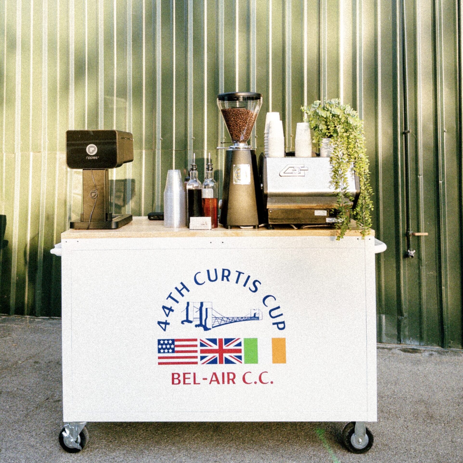 Custom branded coffee cart for an event in Los Angeles with a latte art printer serving hot and iced lattes and matcha