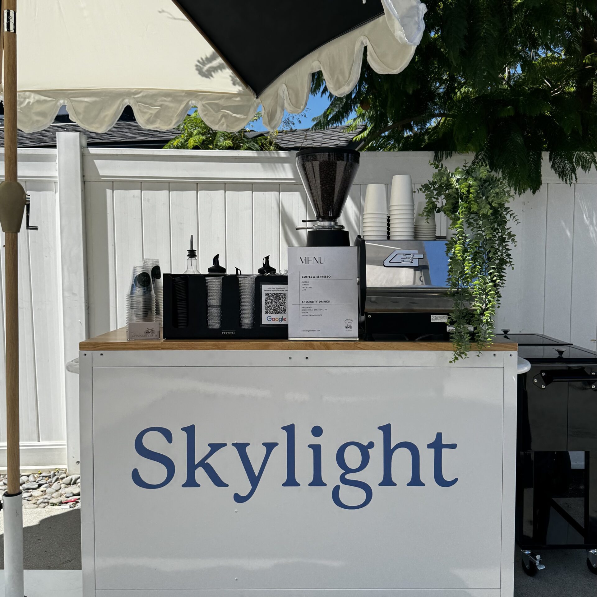 Coffee cart in Los Angeles with custom branding serving hot and iced drinks on a set of a production